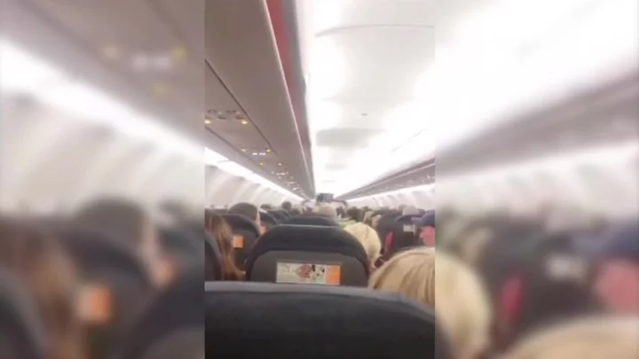 Passenger attempts to exit plane after becoming 'disturbed' by man on flight