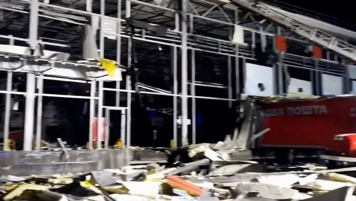 Aftermath of Russian missile strike on Ukraine mail depot that killed six in Kharkiv