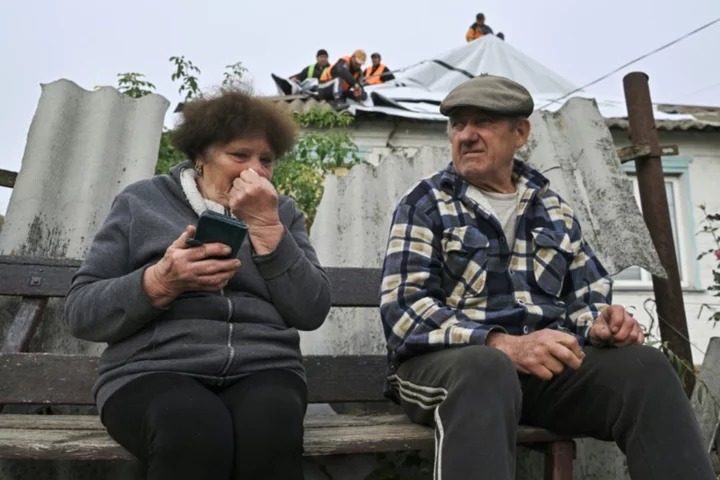 Grief and suspicion in Ukraine village hit by deadly strike