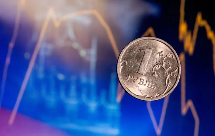 Rouble recovers slightly after slide past 100 vs dollar