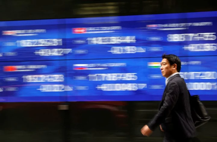 Asian shares climb after Fed hikes as expected; eyes on Europe, Japan