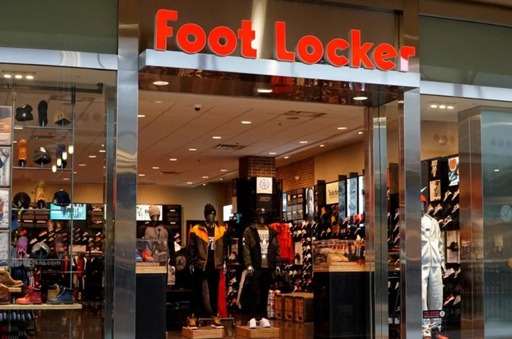 Foot Locker plummets, drags down peers, on forecast cut, dividend pause