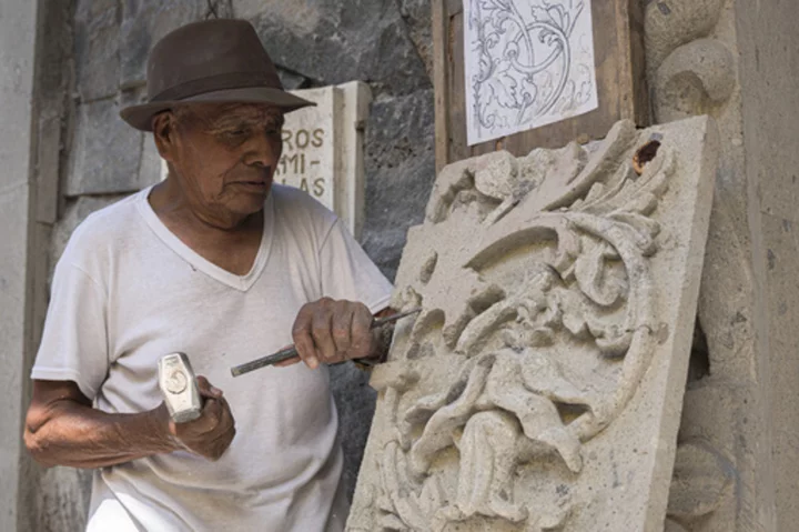 Traditional stone carvers chisel on despite loss of quarries in village swallowed by Mexico City