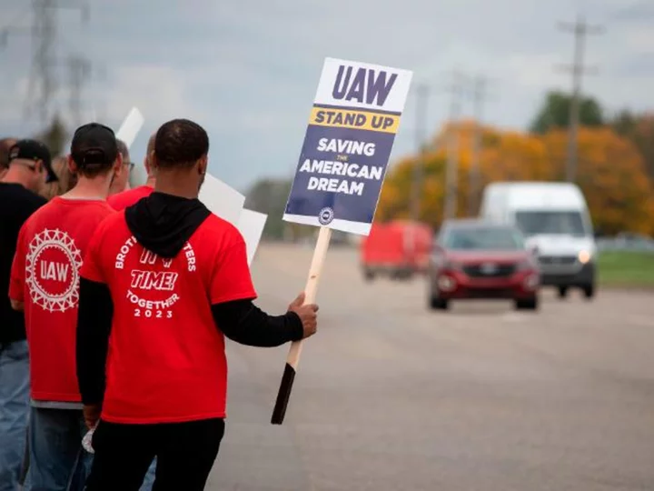 GM earnings rise despite strike