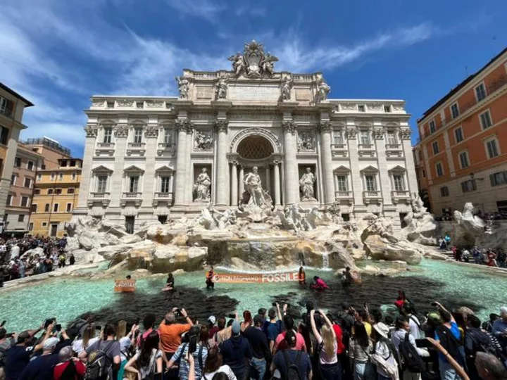 Climate activists dump charcoal in Rome's Trevi Fountain