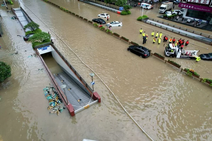 Weaker Doksuri drenches north China, Beijing evacuates thousands