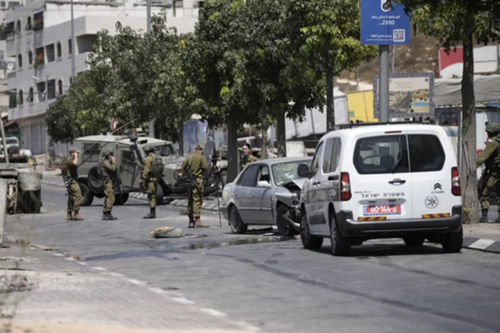 Palestinians clash with own security forces in a West Bank refugee camp, leaving 1 dead