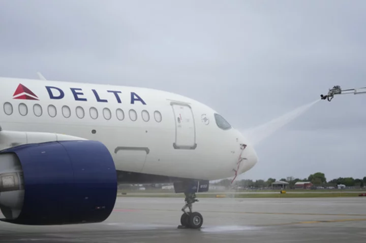 Delta Air Lines employees work up a sweat at boot camp, learning how to deice planes