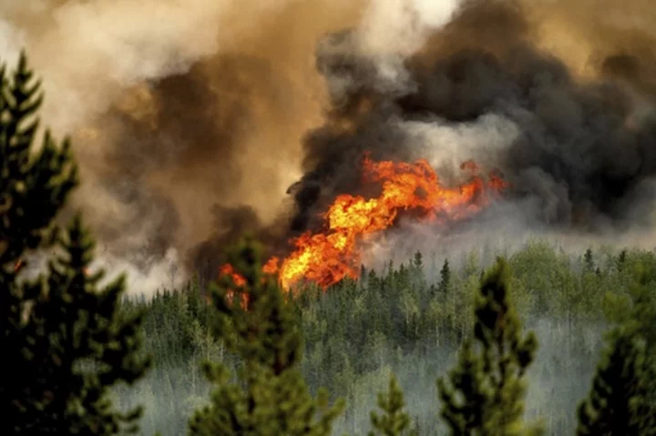 AP PHOTOS: Canada's wildfires blacken thousands of square miles, upend lives