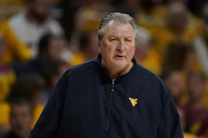 Bob Huggins says he never resigned as West Virginia's coach and wants his job back, attorney claims