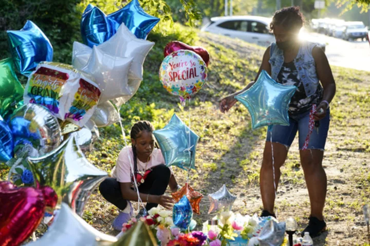 Community mourns teenager's death after gas station owner charged with murder