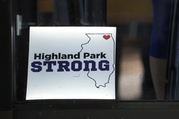 Highland Park marks 1 year after July 4 shooting with community walk reclaiming parade route