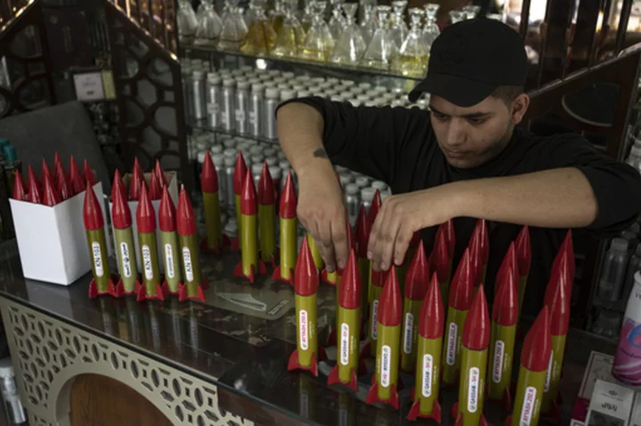 Rocket perfume, anyone? A Gaza vendor sells scents in bottles shaped like rockets fired at Israel