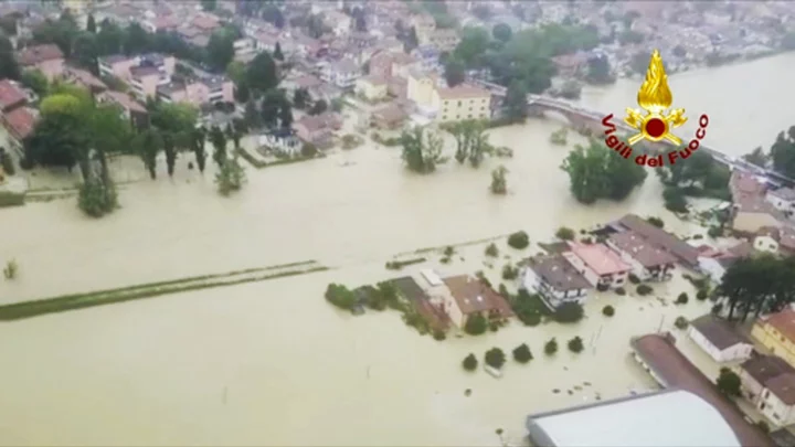 3 dead as heavy rains in northern Italy burst riverbanks, flood towns