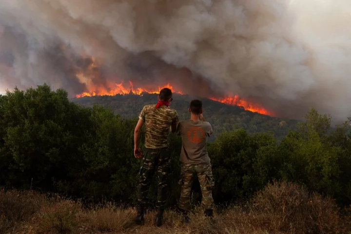 Major wildfires sweeping through forests in Greece force evacuations near Athens and the northeast