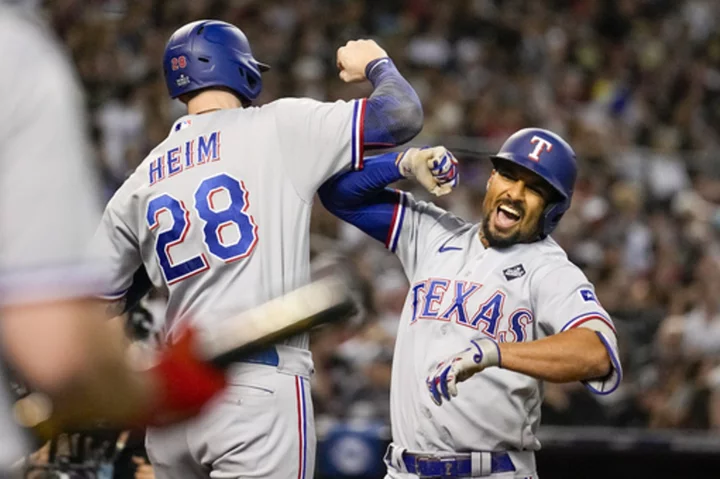 Semien's 5 RBIs, Seager's home run lead Rangers over Diamondbacks 11-7 for 3-1 World Series lead