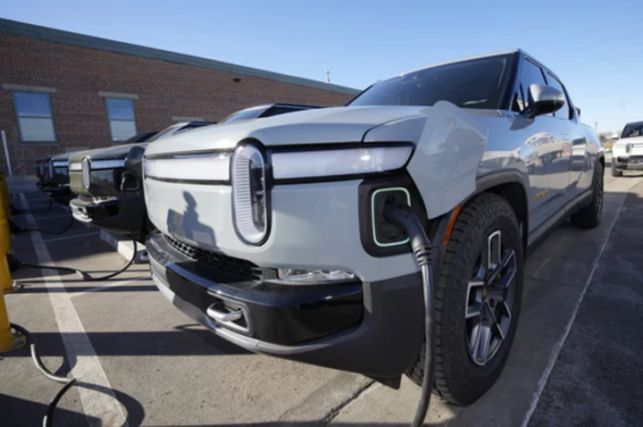 Electric vehicle maker Rivian to join Tesla charging network as automakers consider company's plug