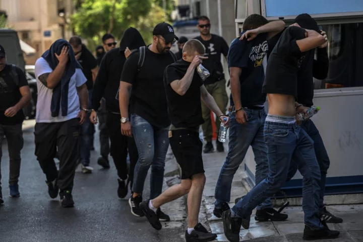 Thirty-five more people charged after fatal stabbing of Greek football fan