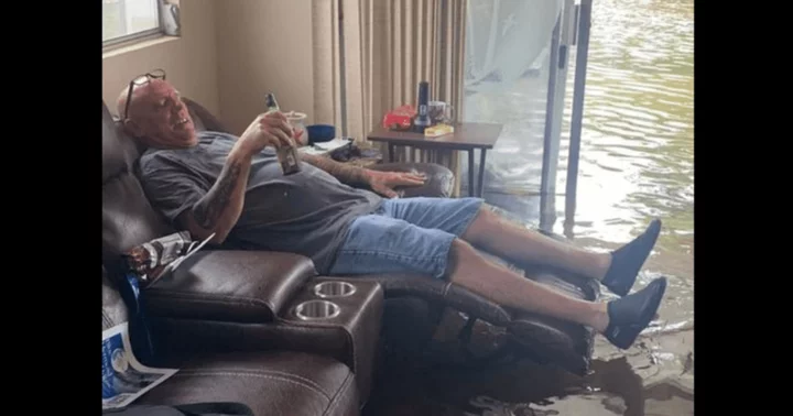 Florida man enjoys beer amid Hurricane Idalia floodwaters on August 30