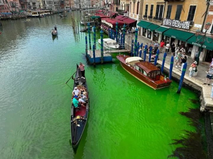Venice authorities investigate after canal turns fluorescent green