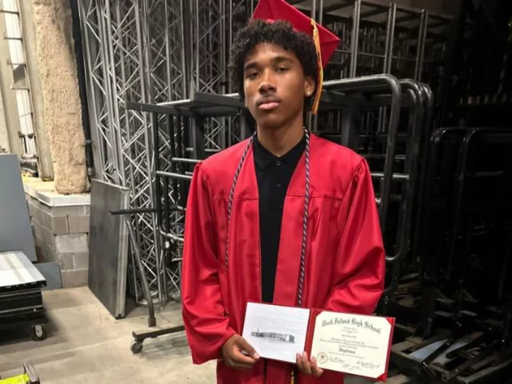 Student graduates on the day his father's body is recovered from the Davenport apartment building collapse