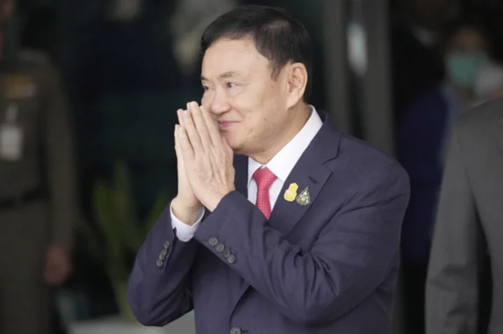 Thailand's king reduces prison term of former Prime Minister Thaksin Shinawatra to a single year