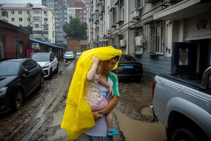 Rain pelts Beijing, northern China for fourth day, killing at least 11