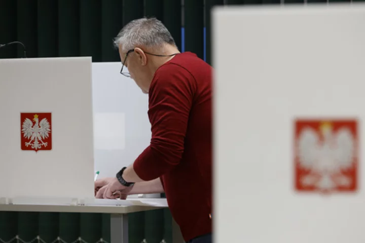 Poles vote in a high-stakes election that will determine whether right-wing party stays in power