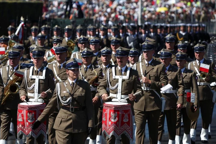 Poland displays military might in huge parade as elections loom
