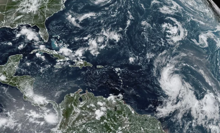 Tropical Storm Lee strengthens into a hurricane as it churns across Atlantic toward Caribbean