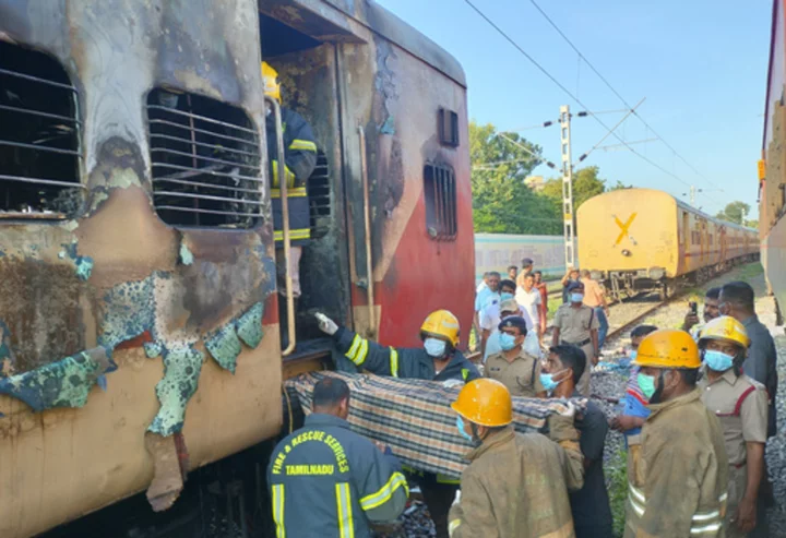 A fire inside a parked train kills 9 in southern India