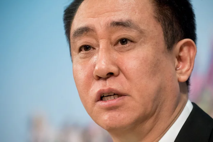 Evergrande’s Billionaire Chairman Hui Is Under Police Surveillance