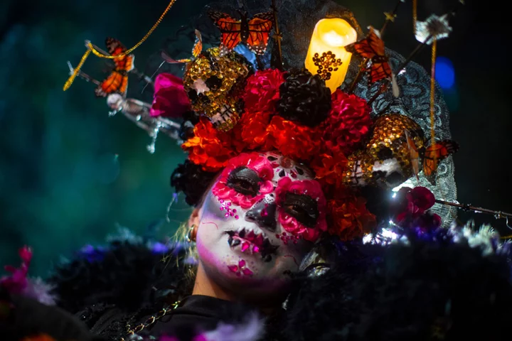 Skulls and flowers on parade at Mexico's Catrinas procession