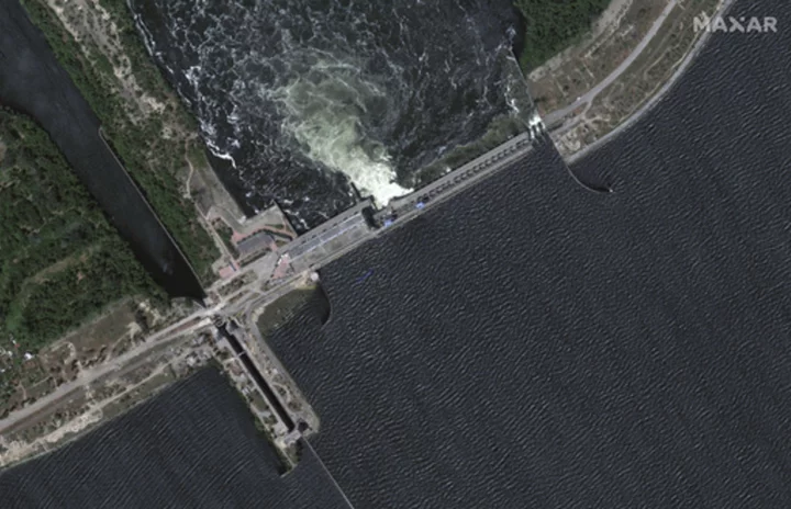 Zelenskyy visits area flooded by destroyed dam as five reported dead in Russian-occupied town