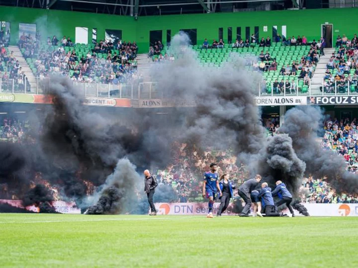 Top-flight Dutch soccer match suspended due to fans throwing fireworks onto the pitch