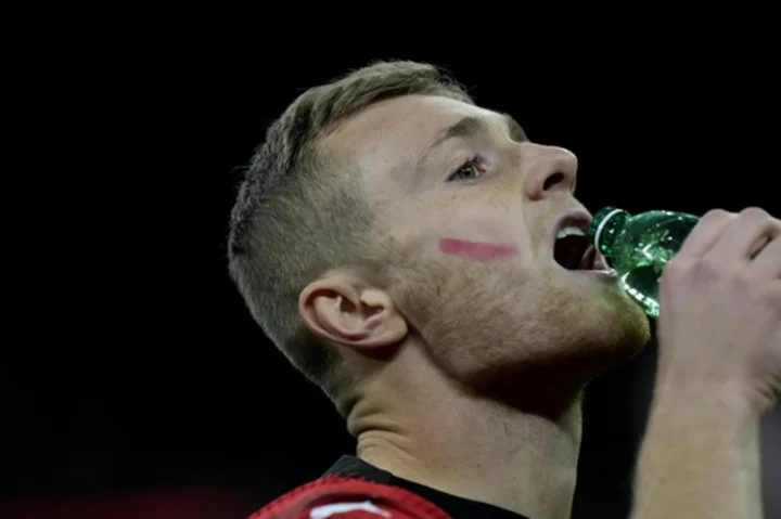 Male soccer players in Italy put red marks on faces in campaign to eliminate violence against women