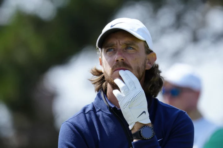 Fleetwood among British Open leaders. McIlroy among the survivors.