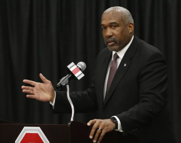 Ohio State athletic director Gene Smith says he'll retire in July 2024