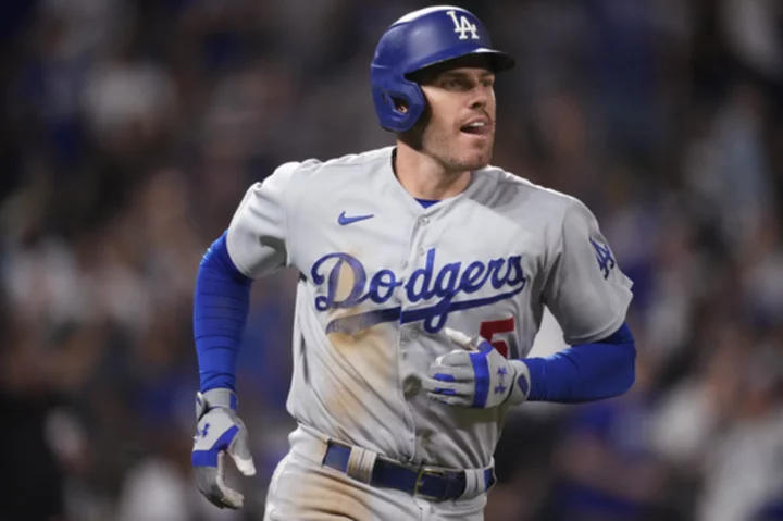 Freeman reaches 100 RBIs and Dodgers beat Rockies 8-2 to near 3rd straight 100-win season