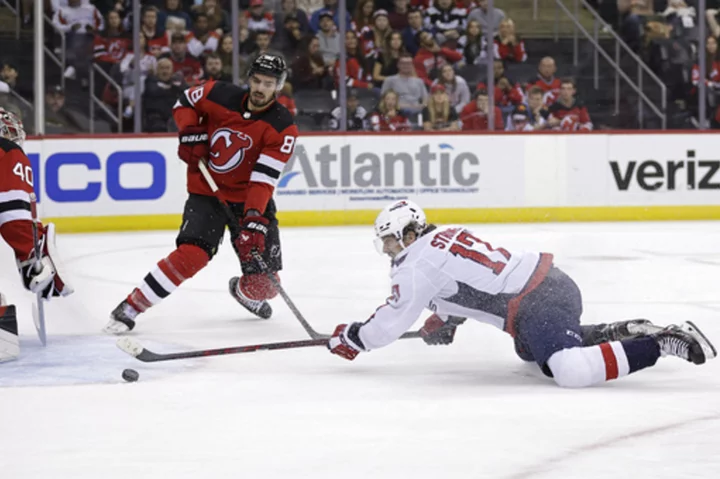 Capitals score three in third to rally for 6-4 win over Devils