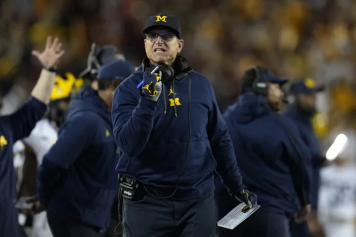 NCAA investigators interview Jim Harbaugh's staff about sign-stealing scheme, AP source says