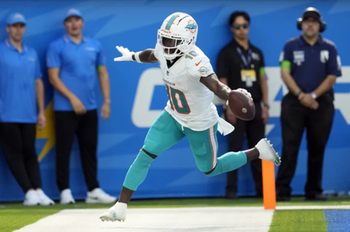 Extra work and familiarity with the Dolphins' system are helping Tyreek Hill excel