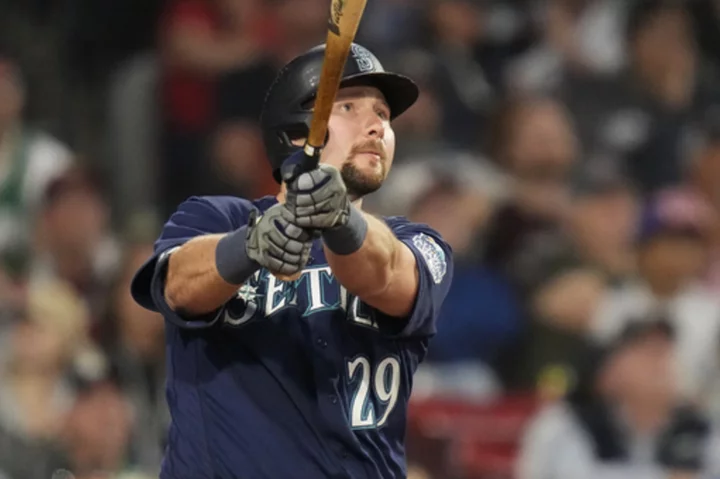 Raleigh first catcher to homer from both sides at Fenway as Mariners pound Red Sox 10-1