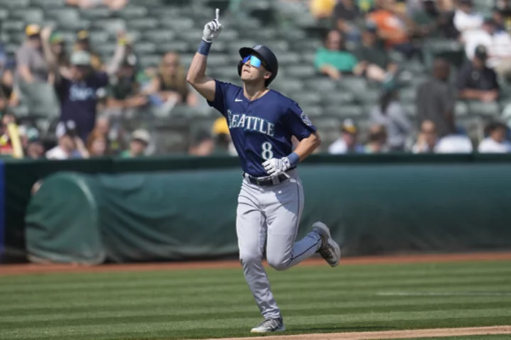 Dominic Canzone homers and drives in 4 runs as the Mariners beat the A's to keep pace with rivals