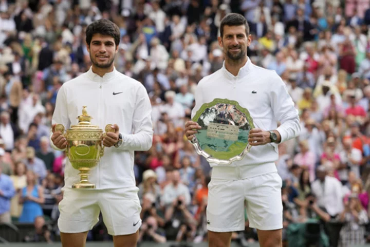 Carlos Alcaraz's Wimbledon trophy keeps him at No. 1. Marketa Vondrousova's lifts her to No. 10