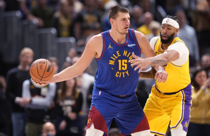 Nuggets celebrate first NBA championship with banner, rings and 119-107 win over the Lakers