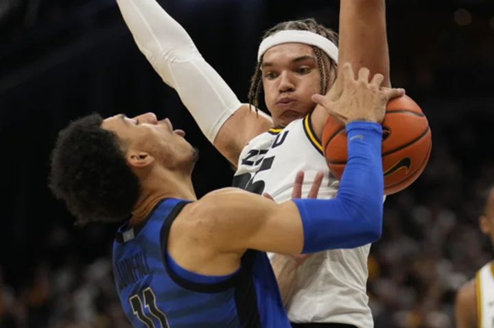 Quinerly scores 18 points, Memphis shuts down Missouri in second half for 70-55 victory