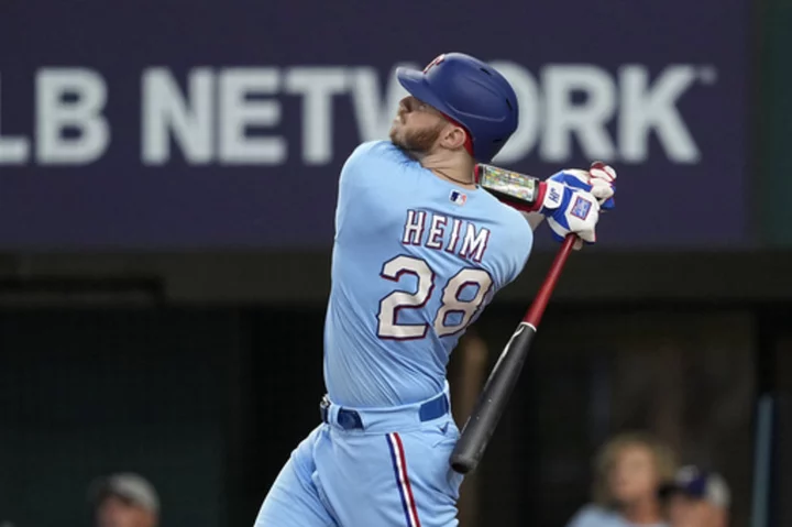 Semien streak at 23, Heim drives in 5 as Rangers keep rolling in 12-3 rout of Mariners