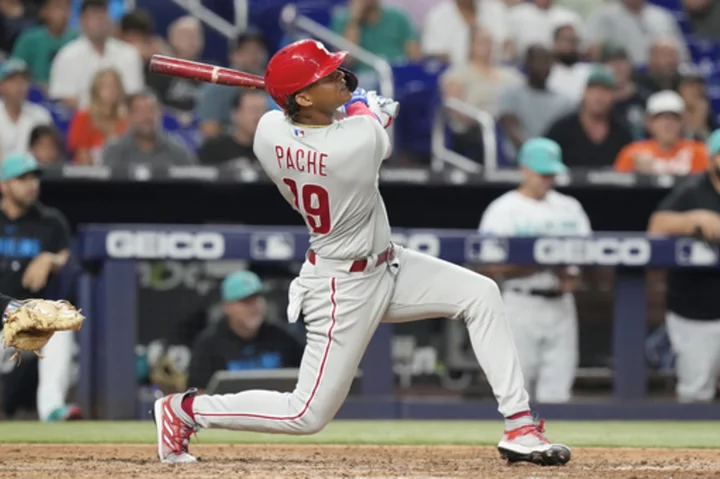 Pache's pinch-hit, 2-run HR rallies Phils past Marlins for record-tying 13th straight road win