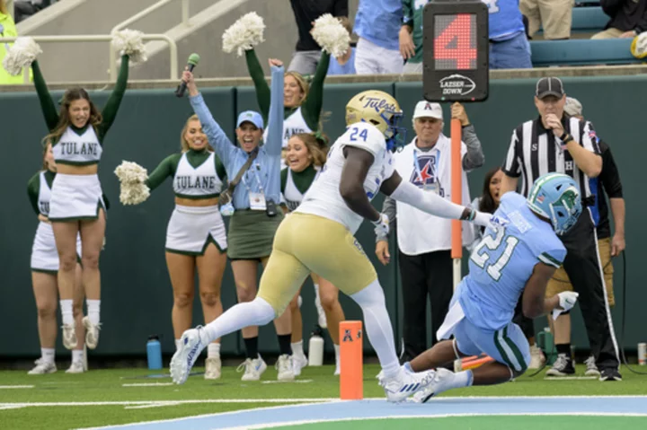Makhi Hughes' 131 yards and touchdown help No. 20 Tulane hold on against Tulsa, 24-22